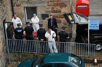 PROBE: police removed two bodies from flat