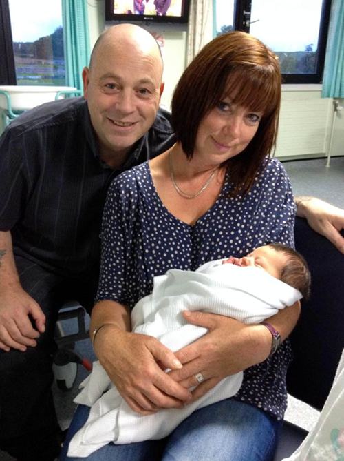 Vince with his wife Fiona and their first grandson.