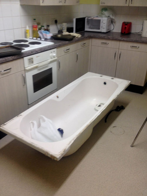 The students brought the bath home and left it in their kitchen