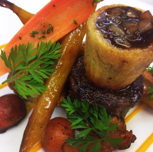 Tom Kitchin has served the beef with carrots and bone marrow potatoes