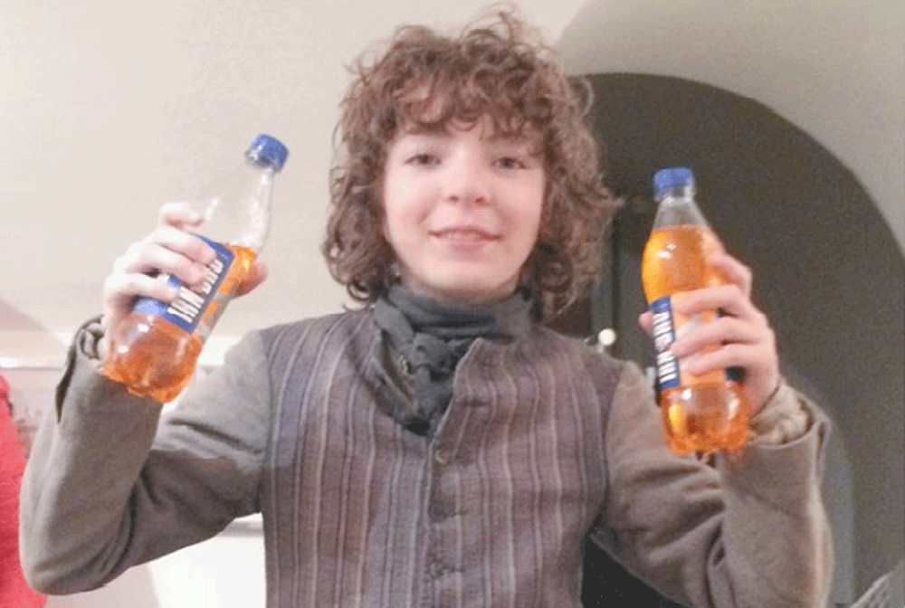 The young actor, Roman Berrux, poses proudly with his Irn Bru
