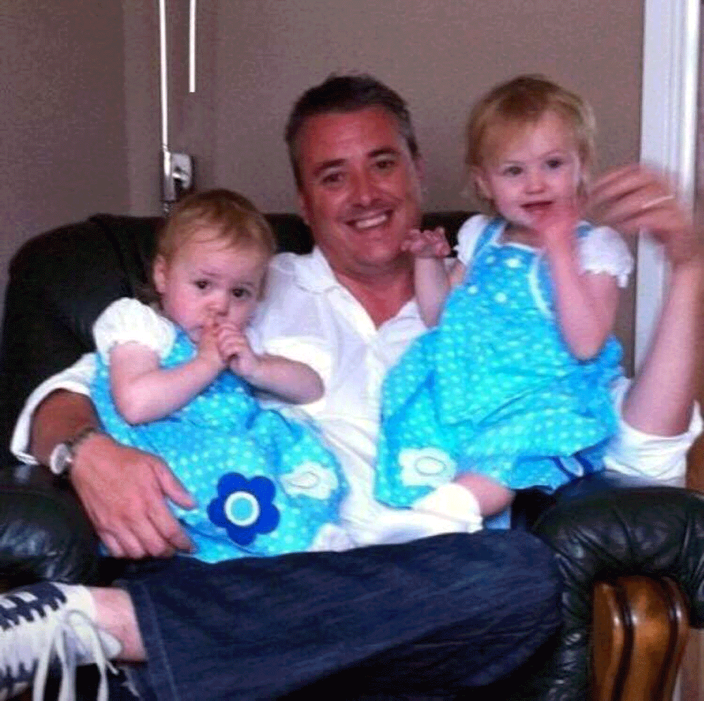 Alan with his two daughters when they were younger