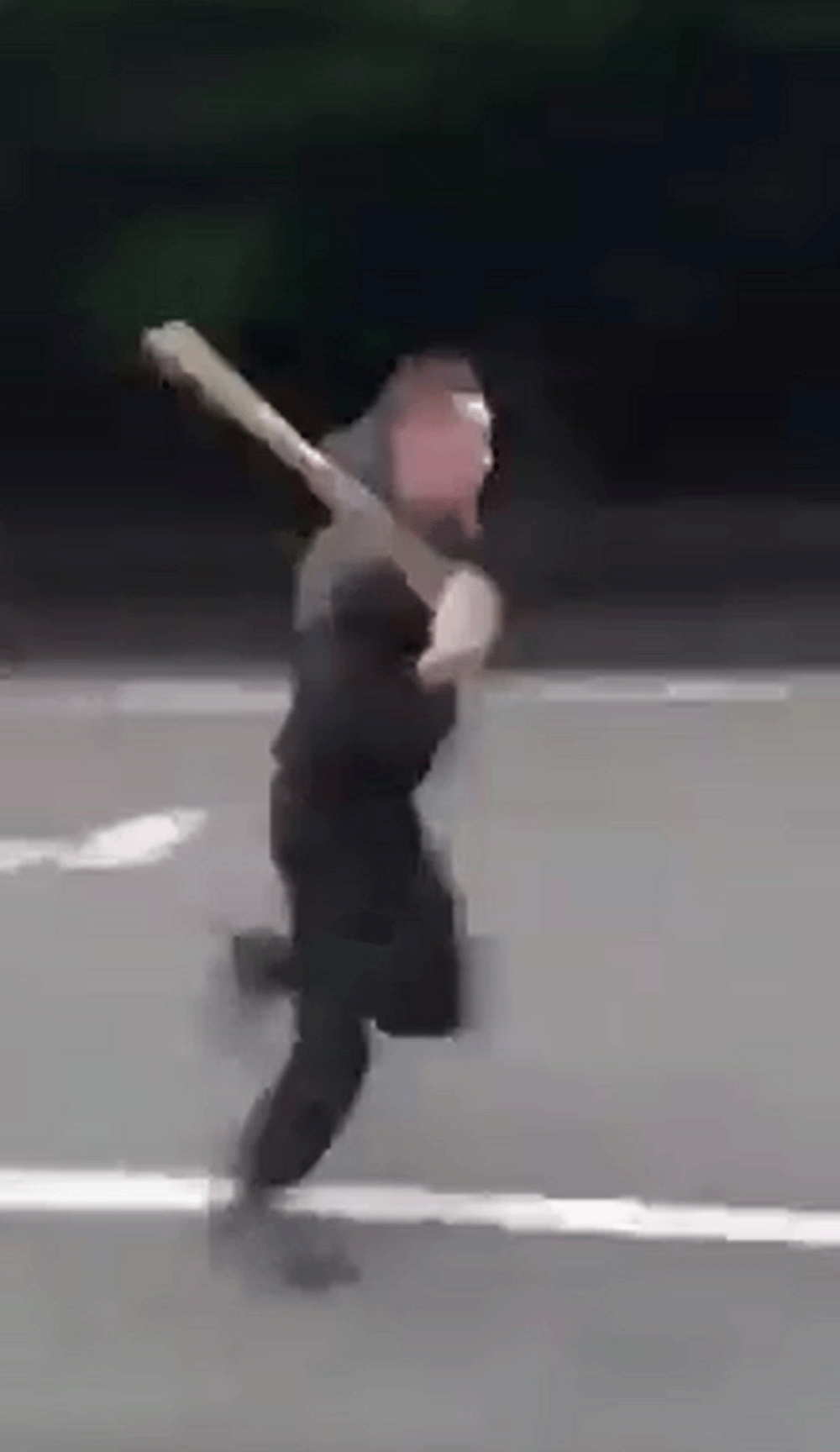 One man could be seen running down the road with a baseball bat