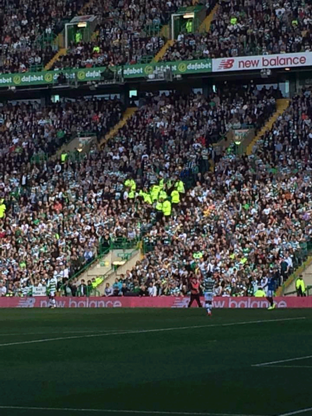 A photo taken from the Rangers end of the scene among the Celtic crowd