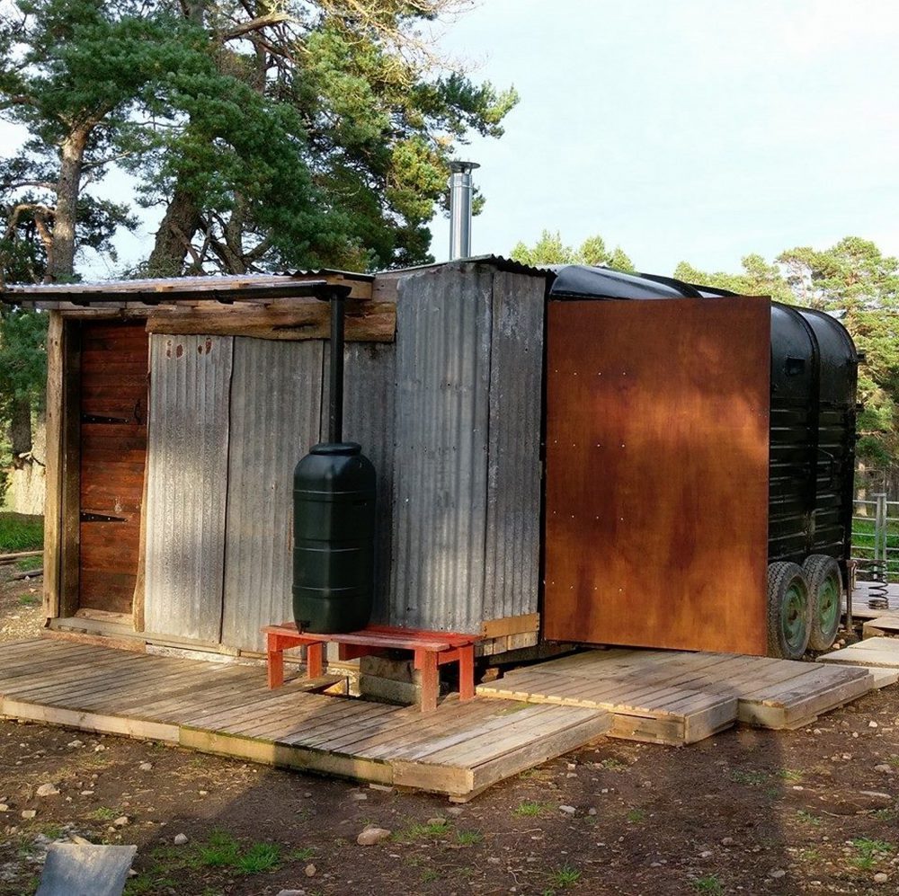 THE UK'S first "glamping horsebox" is for rent on Airbnb for just £30 a night. Constructed using a vintage horsebox, wooden pallets and corrugated iron, the the  home-from-home boasts its own "composting toilet" comeplete with "full instructions". The "Prancing Pony Wild Glamping Pod", in Bonar Bridge, an hour north of Inverness, also has a built in shower and kitchen sink. Guests can also enjoy the "garden" - four acres of stunning Caledonian Pine forest - and little details such as the loo roll holder made from a horse's bit. Owner Stacie MacDonald says on the website "you'll love it if you're more Girl Grylls than high heels" and if you're a guy looking to be a "Wild Man of the Woods". Holidaymakers seeking the "off grid" retreat will have the full experience, according to the description, with drinking water in a portable tank and a shower that is heated using solar panels with a rain capture system. Capable of accommodating two people, with a fold out futon bed, the toilet is accessible from the outside and also through a "tiny" door for inside the trailer.