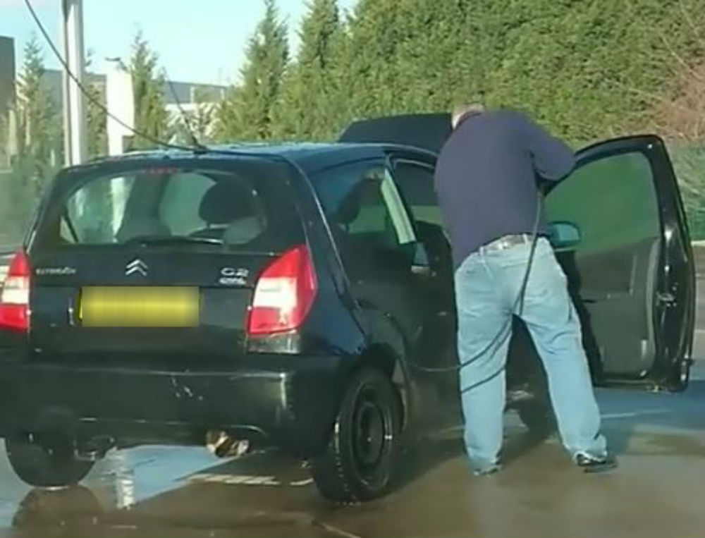 "Defo a serial killer" Clip of man power-washing INSIDE of car sends internet wild with speculation