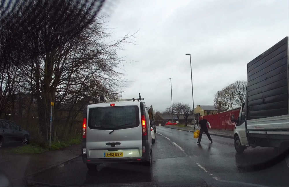 "Scrap man has own rules of the road" Van almost hits pedestrian, drives on wrong side and jumps red