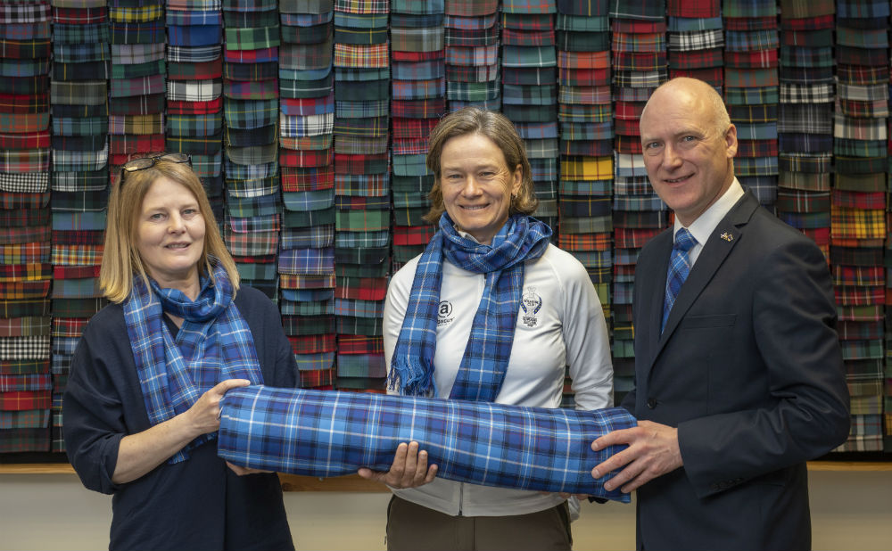 A SPECIALLY commissioned tartan designed to celebrate The Solheim Cup’s return to Scotland has been unveiled. Scotland’s Minister for Public Health, Sport and Wellbeing, Joe FitzPatrick and European Solheim Cup Captain, Catriona Matthew revealed the design following a factory tour of leading tartan manufacturers, Lochcarron of Scotland in Selkirk. VisitScotland commissioned the company to create The Official Solheim Cup Tartan which comprises a blue, red, yellow and white design to mirror the colours on the flags of Scotland, Europe and the USA.