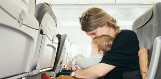 Mother on plane with baby