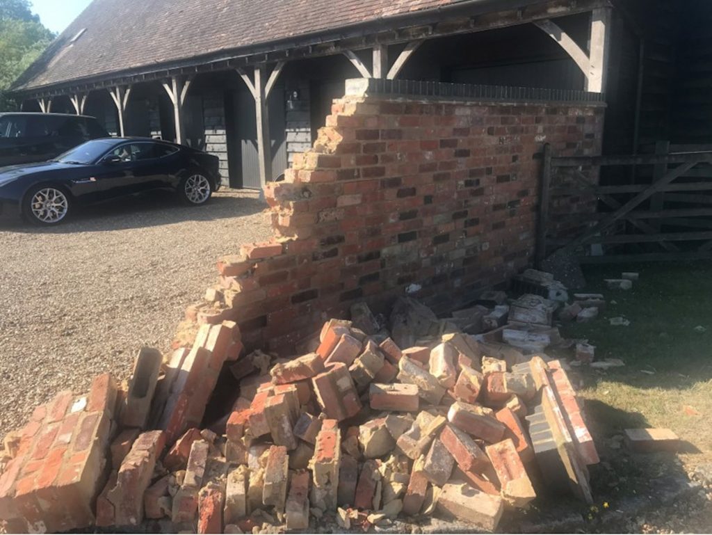AN “UNINSURED” Amazon driver has left residents of a hamlet with a £3000 bill after totally destroying a wall.