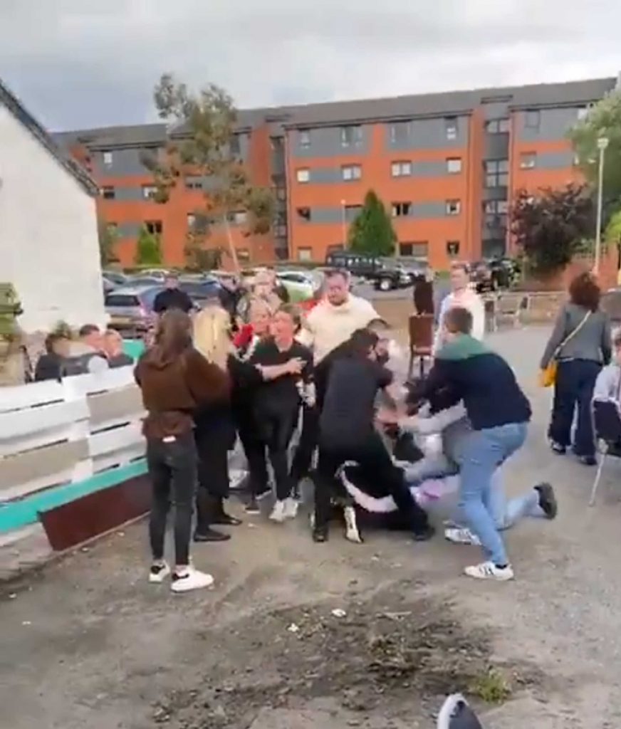 A mass brawl taking place outside a pub the first day that beer gardens opened