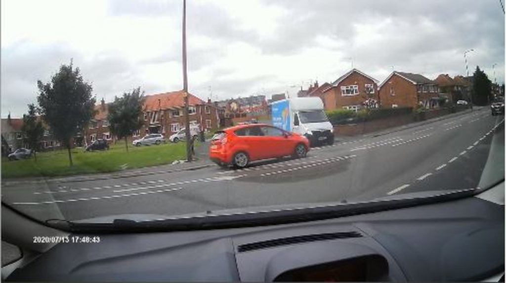 Hermes delivery driver pulls out at a junction and collides with another vehicle.