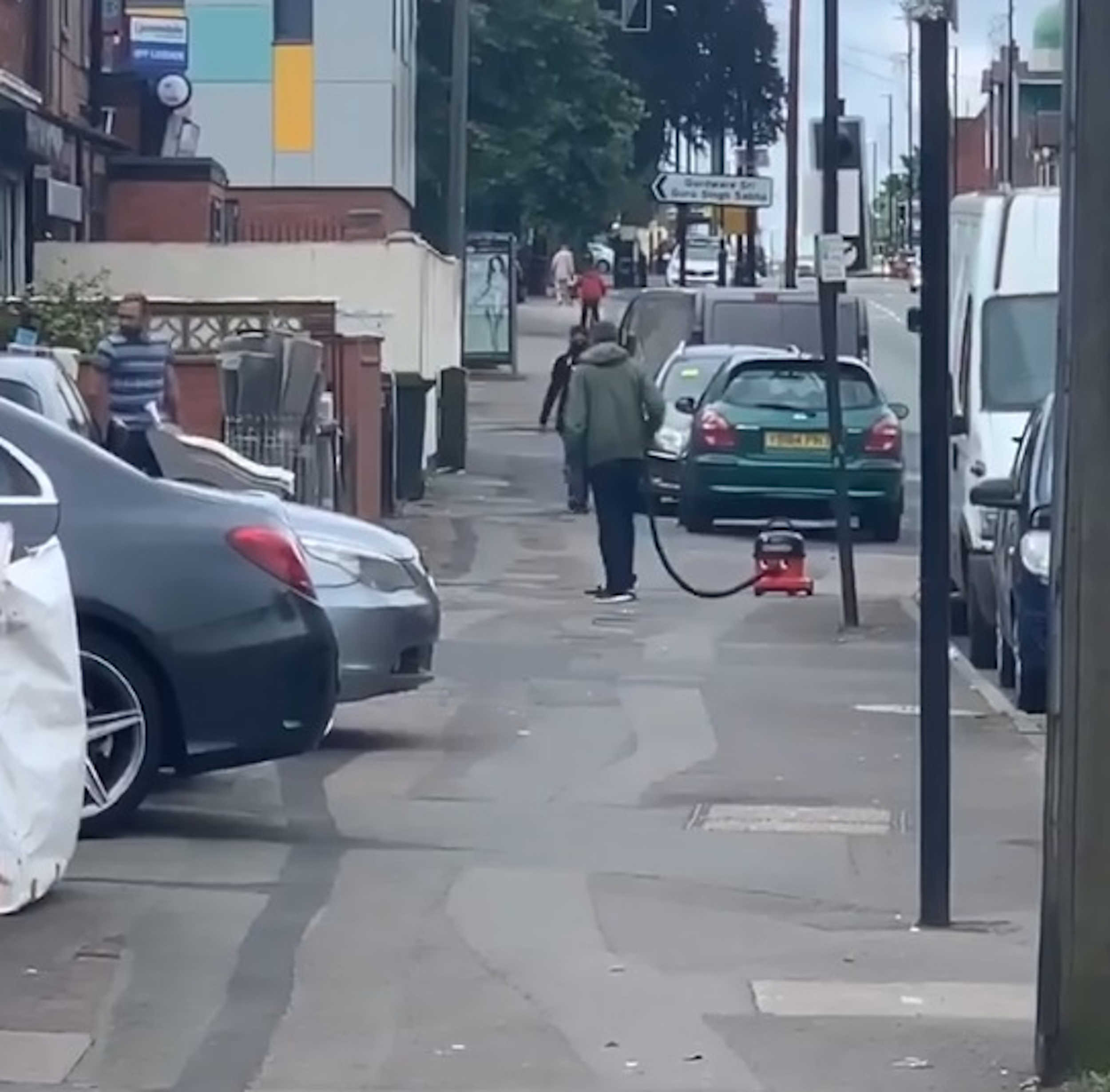 Man vacuuming street Coventry