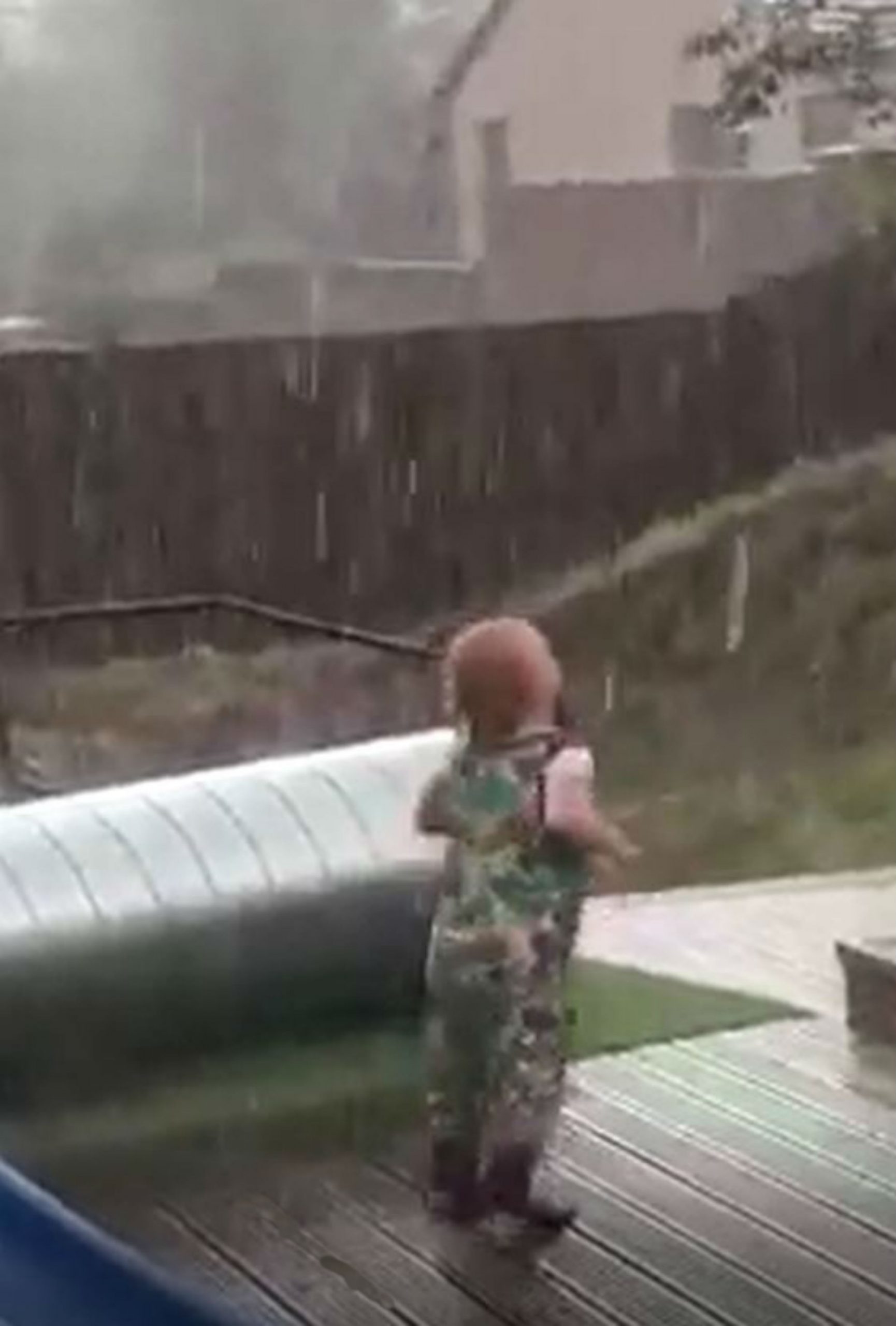 baby dancing in rain