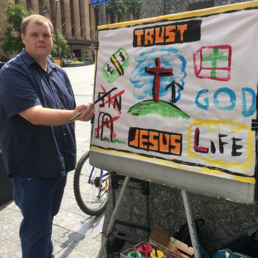 Pastor with sign