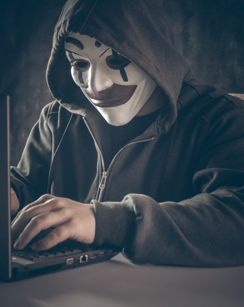 An anonymous hacker using a computer