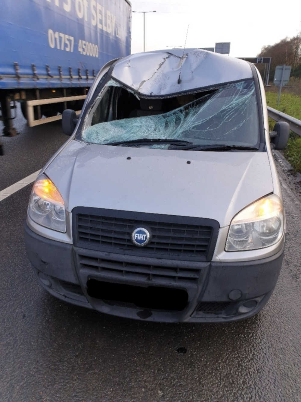 A silver van was crushed by a tyre from a lorry - UK News