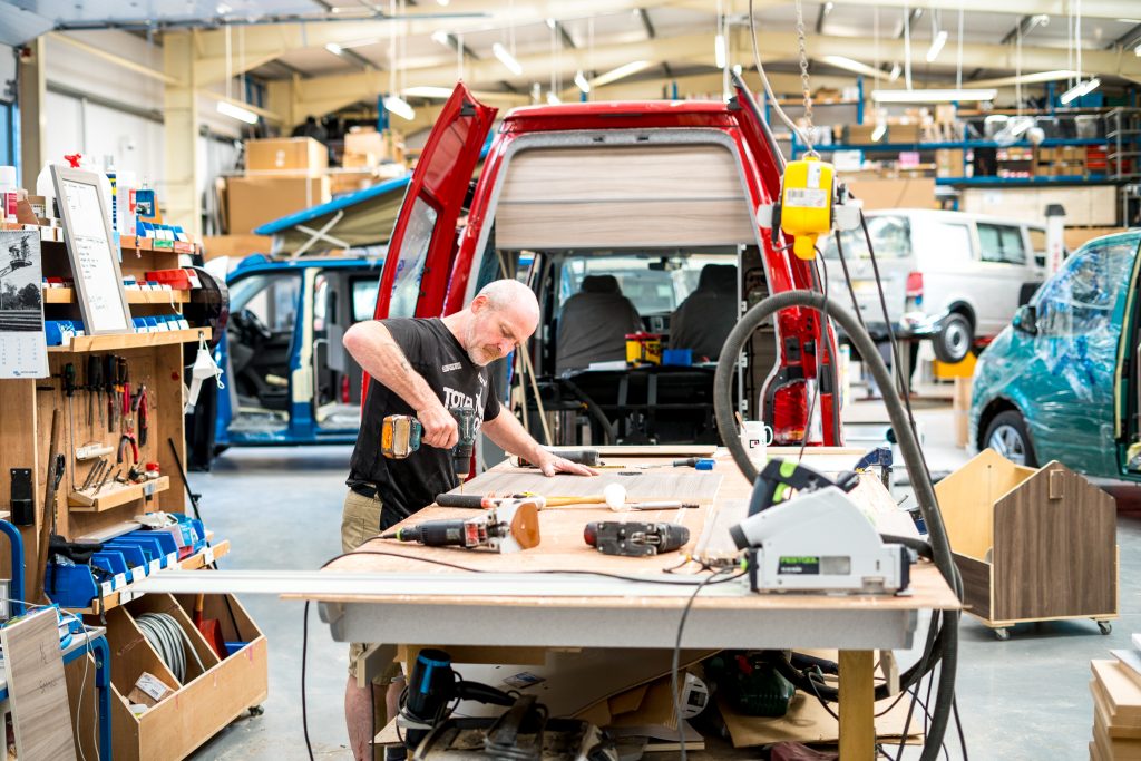 Carpenter working on VW campervan conversion. Scottish Business News