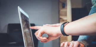 People pointing at a computer screen - business news Scotland