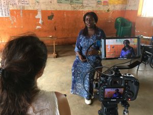 the team interviews Agnes Akullo from Irise International for the documentary - Scottish News