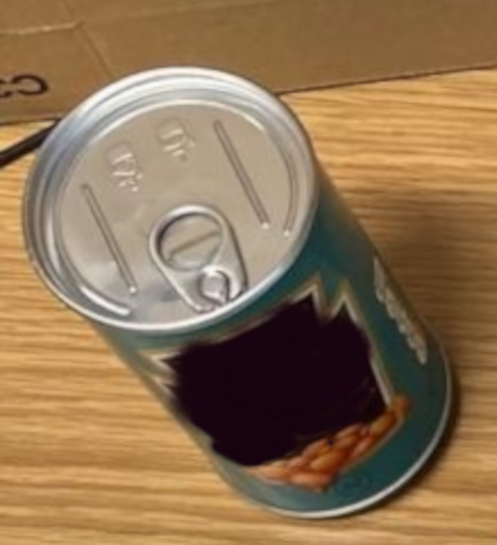 Close-up on fake tin of Heinz beans - Police News
