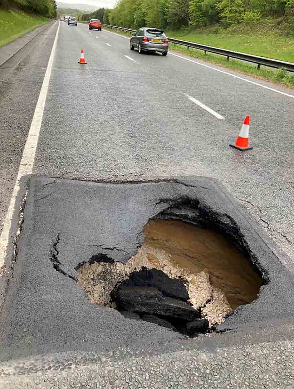 Shocking images show large sinkhole appear on busy motorway - UK News