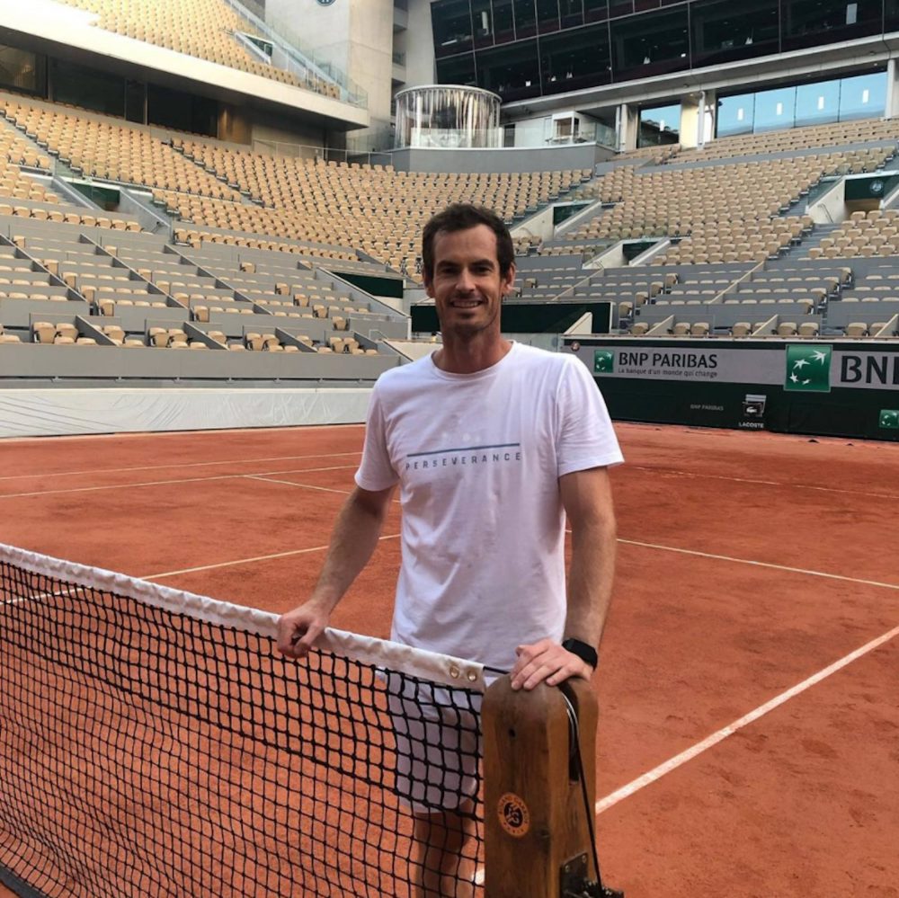 Andy Murray by a tennis court | Scottish Sports News