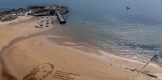 A Scottish festival has created a giant sand portrait to urge support for young musicians - Scottish News