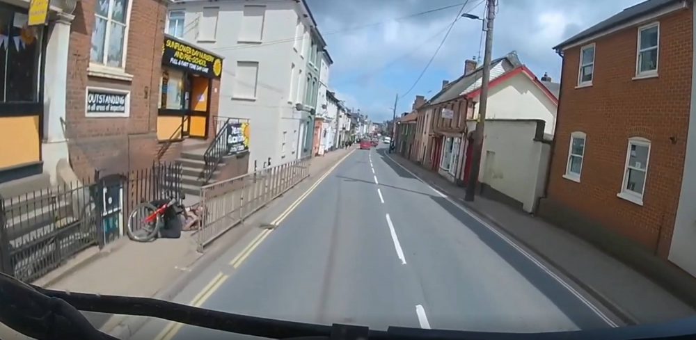 Cyclist laying in a heap on the pavement | Traffic News UK