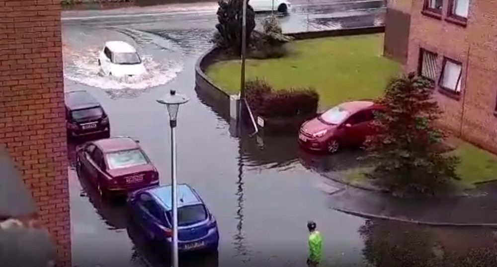 Uber Eats cyclist looking at puddle - Scottish News