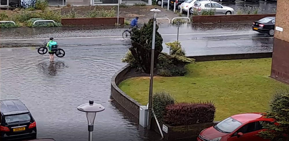 Uber Eats cyclist in puddle - Scottish News