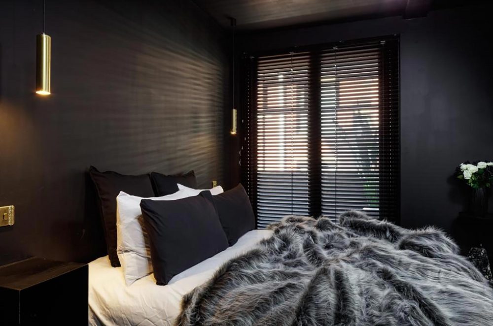 The bedrooms have fur across the beds and dark blinds - Property News UK 