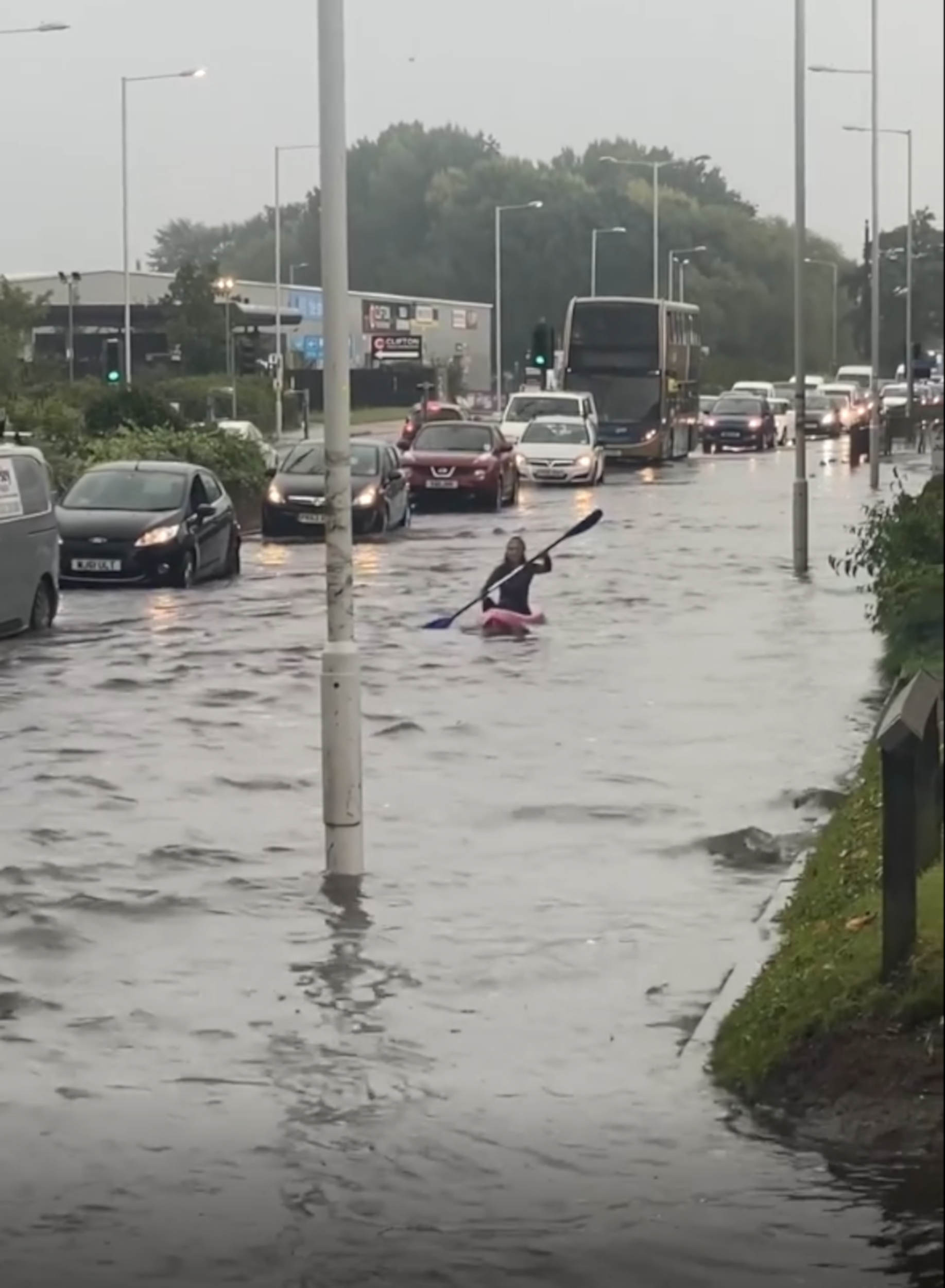 Kayaker doing laps of street - weather news UK