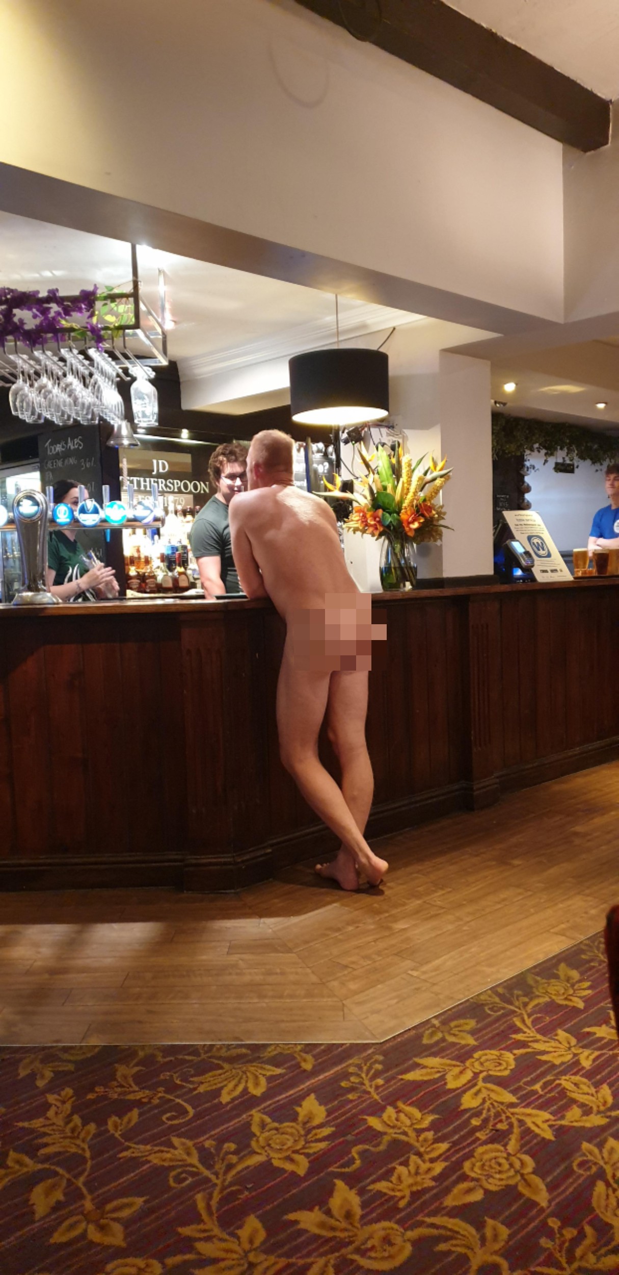 Naked man standing at Wetherspoons bar - UK and World News