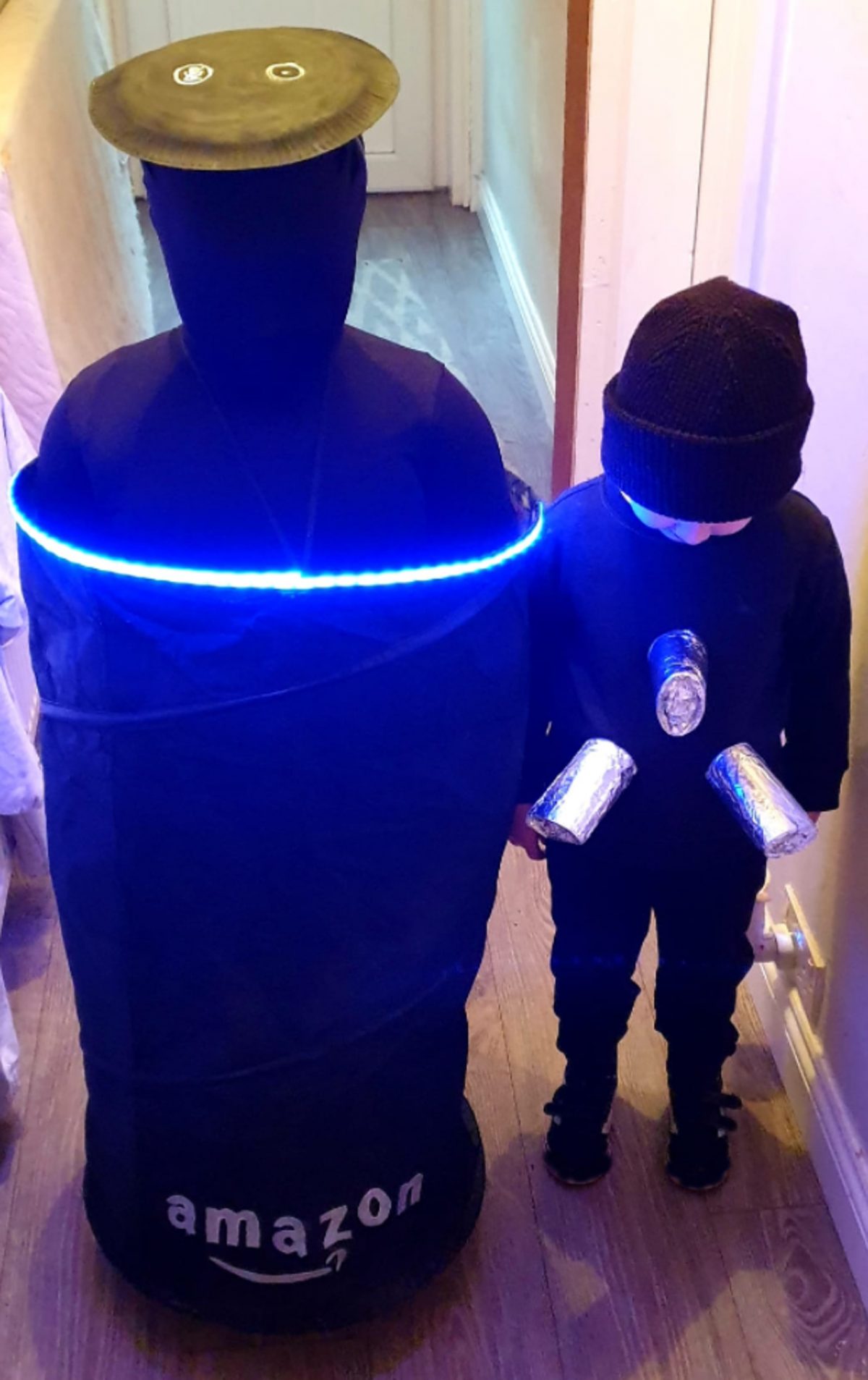 The cousins dressed up as Alexa and a plug