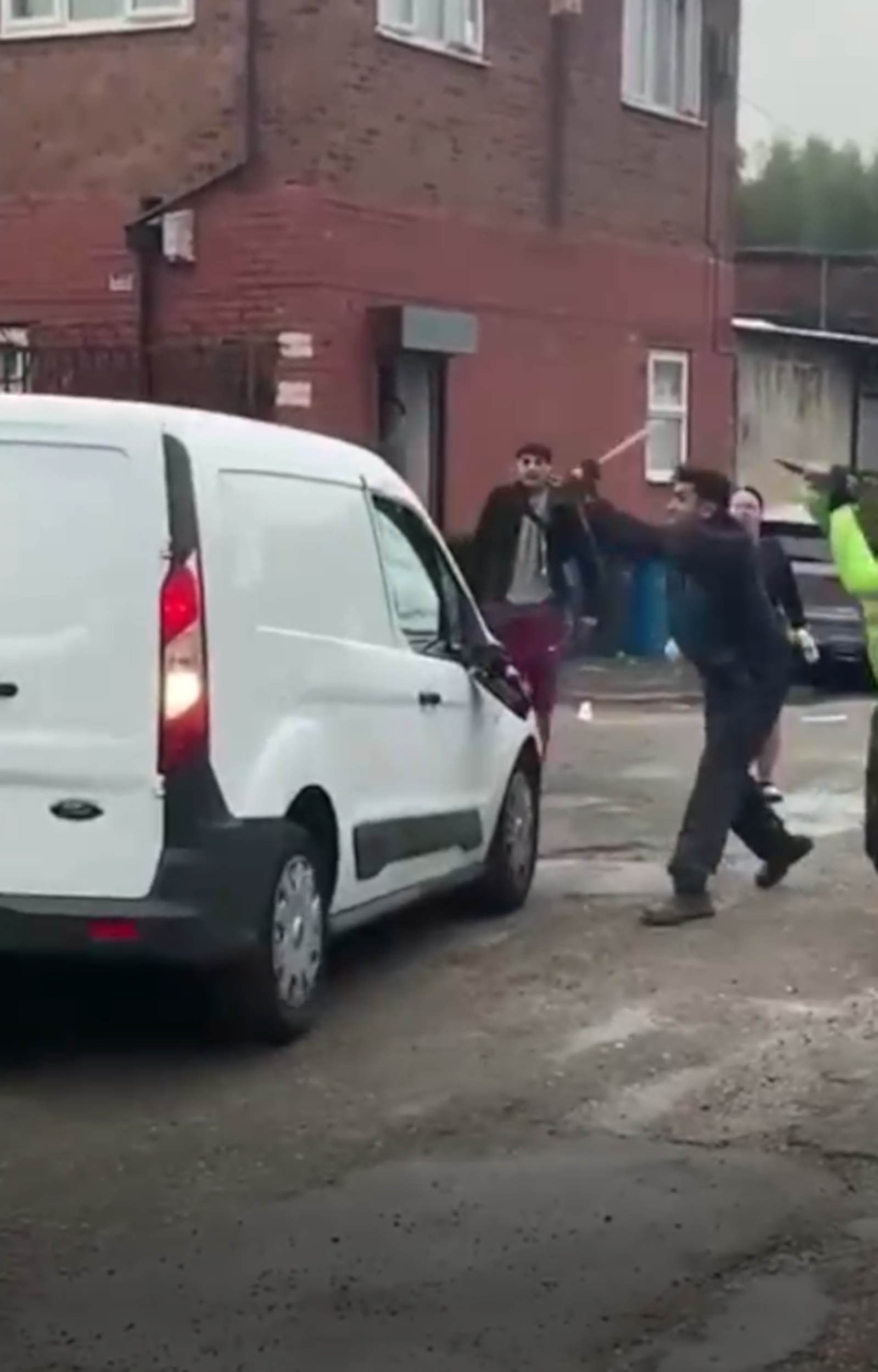 Man smashing windscreen in Jewson fight