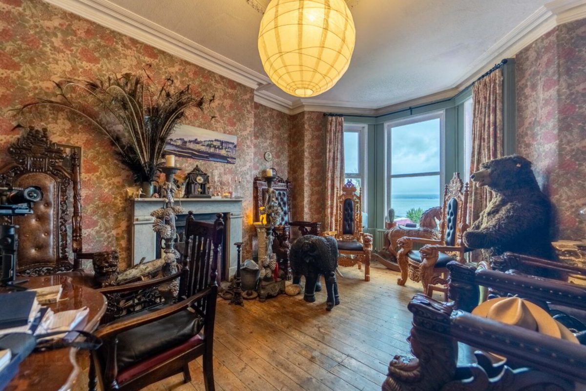 The wild living room of the bizarre house for sale.
