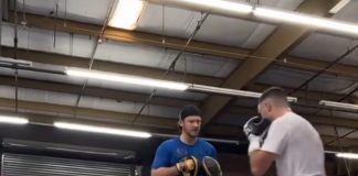 Josh Taylor trains with his coach