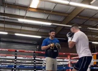 Josh Taylor trains with his coach