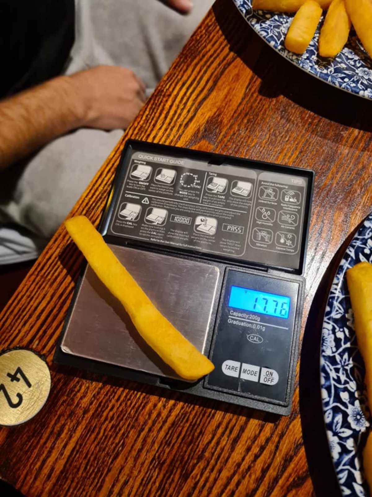 Ashley's weight being measured on a set of scales