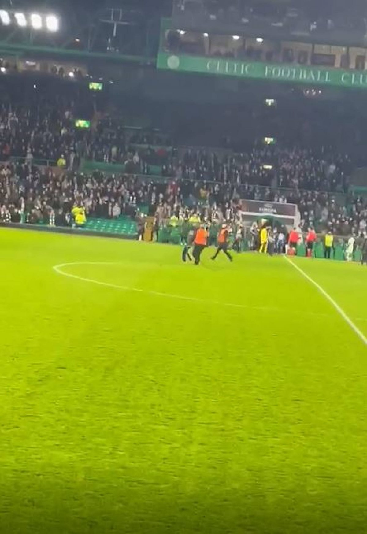 The Celtic fan is caught by the stewards