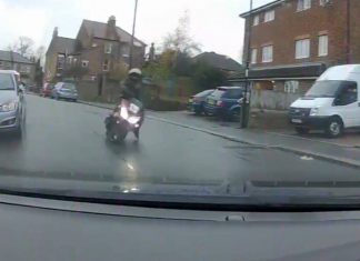The biker falling onto the road