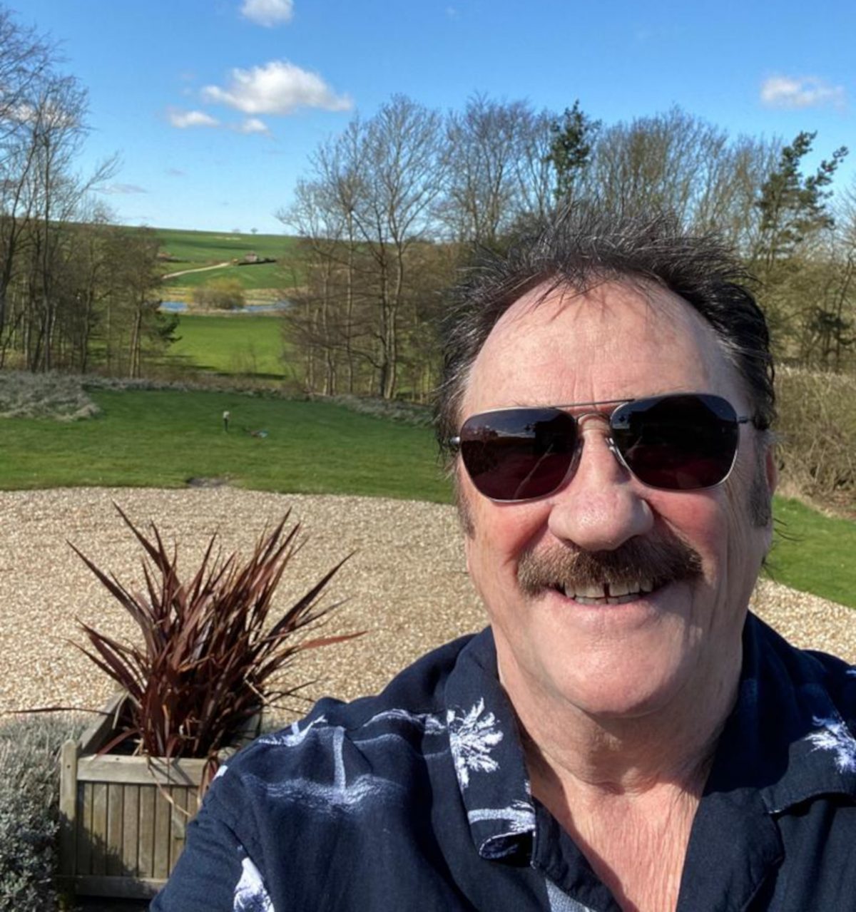 Paul Chuckle outside his home