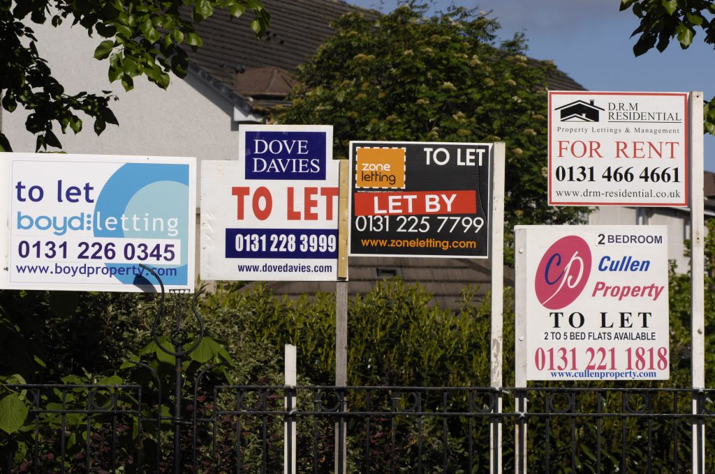 Photo of frenzied property rental market shown by to let, to rent and for sale boards in Edinburgh