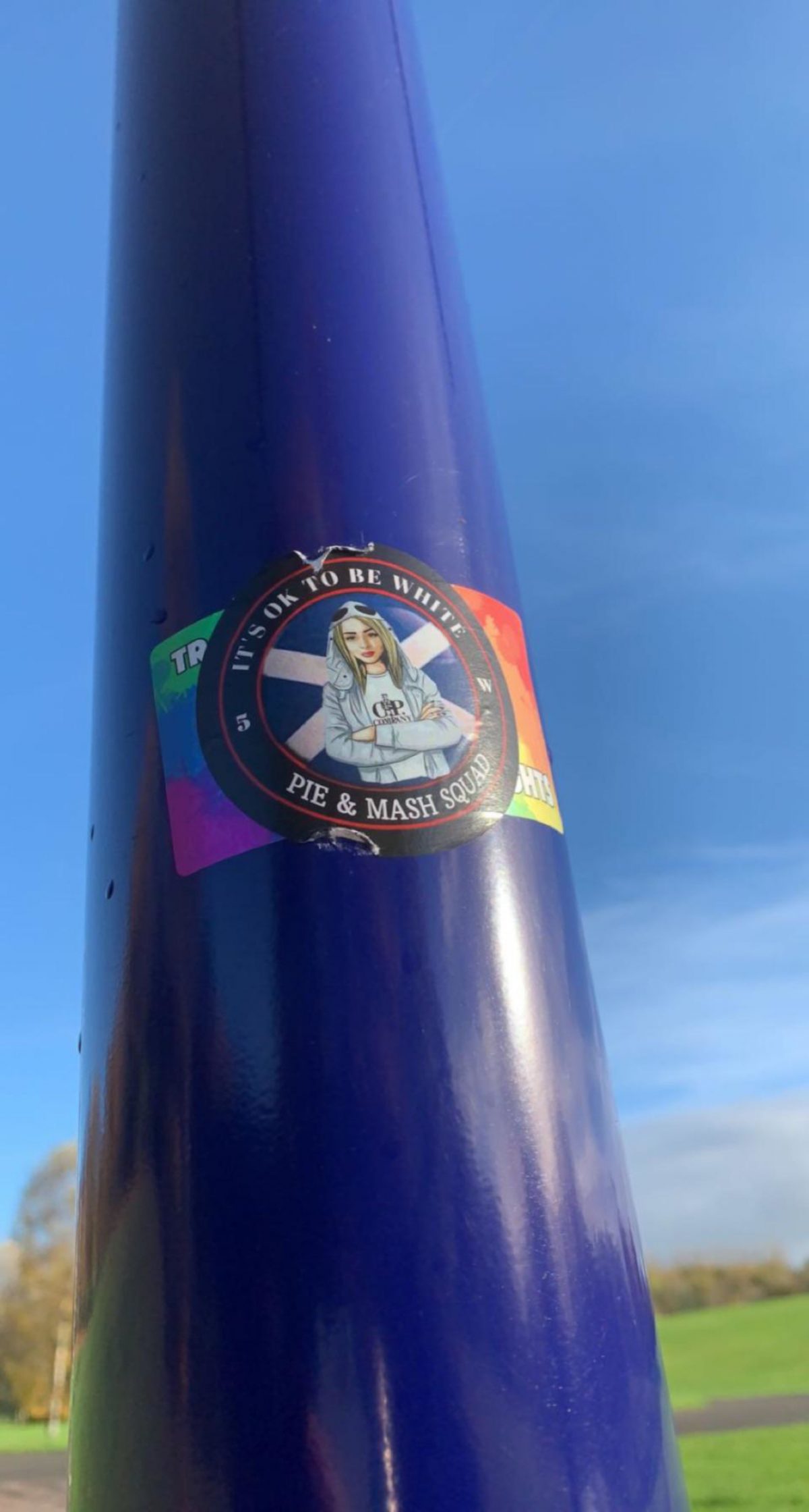Another far-right sticker covering an LGBT sticker.