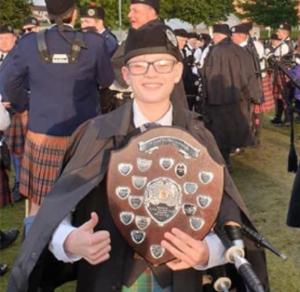 Warren Graham with a piping award