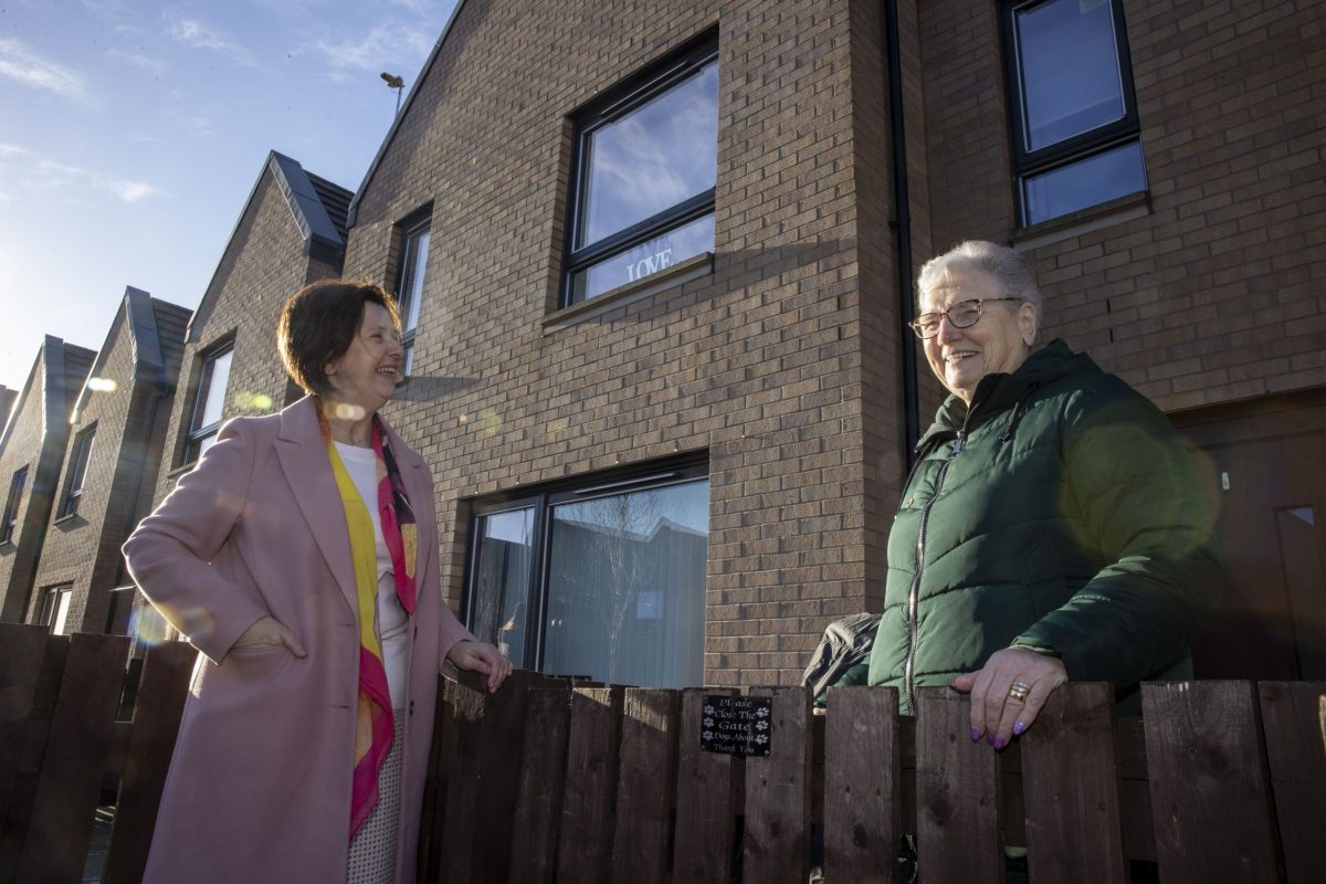 GHA Chair Bernadette Hewitt chats with tenant Harriet Sinclair over the garden fence at Fountainwell Road in Sighthill.