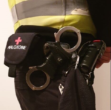 Police officer with naloxone pouch.