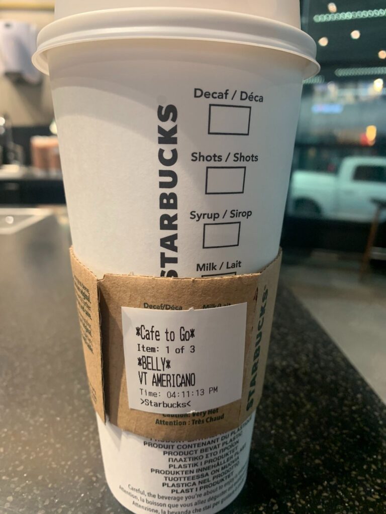 The Starbucks cup with "Belly" as the name