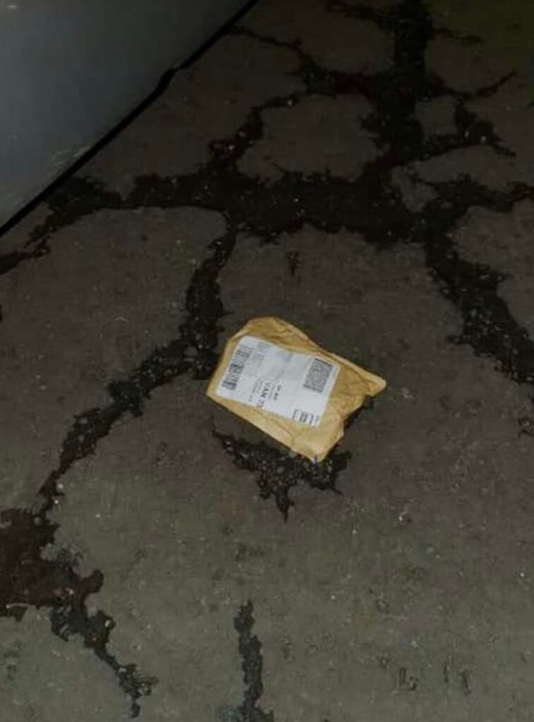 The courier took this photo before the package was burned